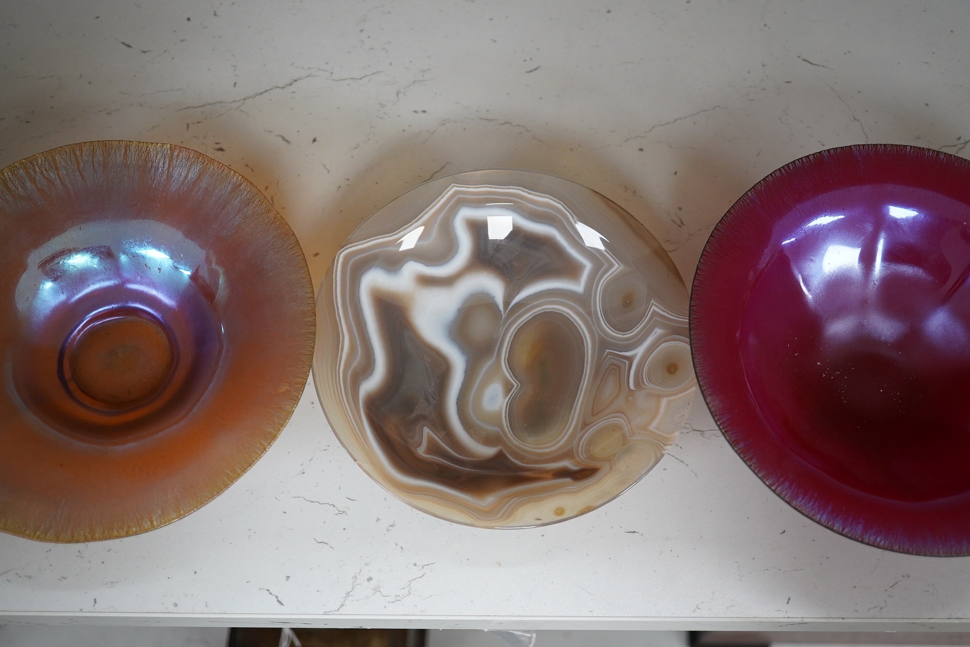 Two iridescent WMF art glass bowls and a polished agate bowl (3). Widest WMF bowl 16.5cm diameter. Condition - good